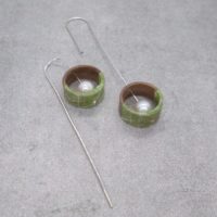 Sophisticated tiny green round tail hanging earrings with back tail created by Japanese artist