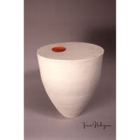 Large white vase with red hole